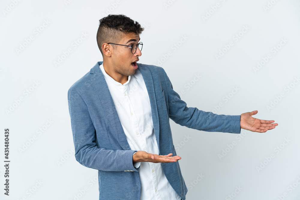Young business Brazilian man isolated on white background with surprise expression while looking side Young business Brazilian man isolated on white background with surprise expression while looking side