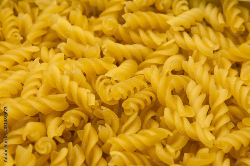 a lot of pasta. spiral noodles. noodles in a saucepan. cooking concept a lot of pasta. spiral noodles. noodles in a saucepan. cooking concept