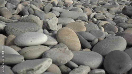 Stones on the seashore, close-up. Gray stones, pebbles and cobblestones