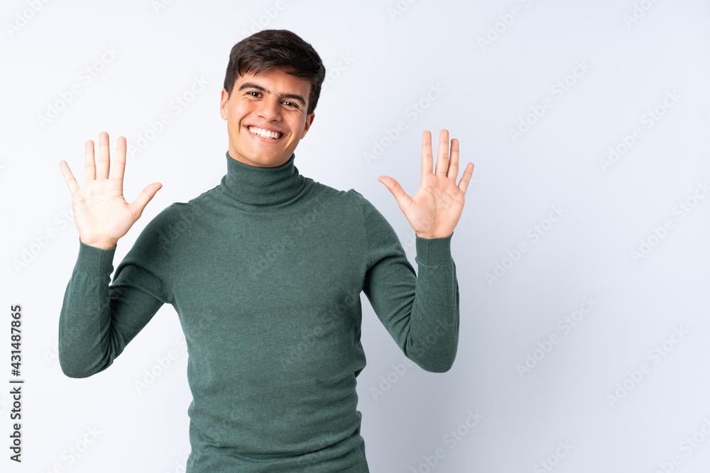 Handsome man over isolated blue background counting ten with fingers Handsome man over isolated blue background counting ten with fingers
