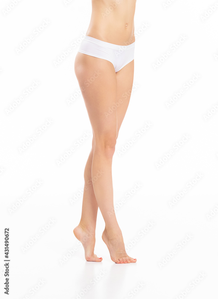 Close-up of a beautiful and fit female figure. Studio photo of young woman's body in swimsuit.
