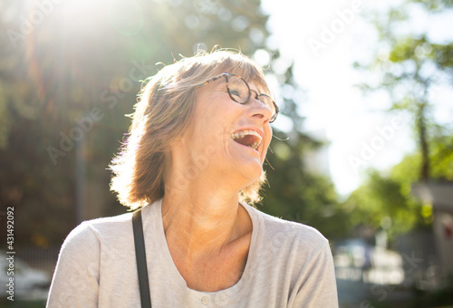 Close up laughing older woman with glasses