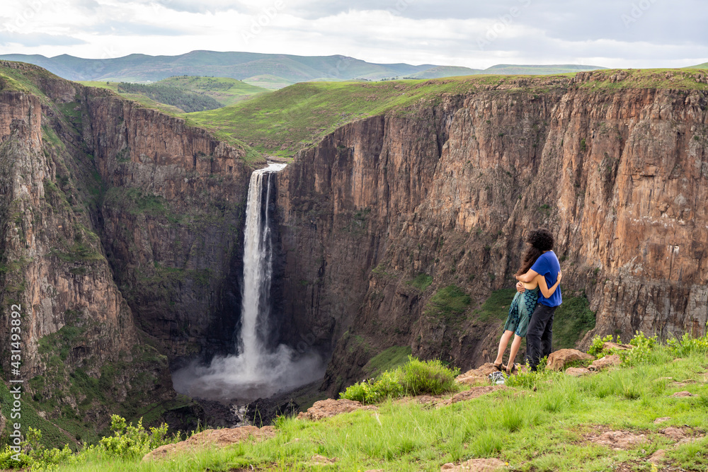 couple looking at Maletsunyane Falls, Lesotho Africa 