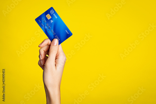 Female hand holding bank credit card photo