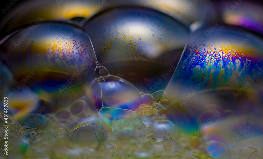 The colorful world of soap bubbles resembling space and honeycomb