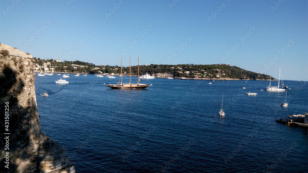 Boats in harbor. Beautiful panoramic landscape of Villefranche-sur-mer on a sunny day. Wonderful trip to the Cote d'Azur in France. Scenic harbour view of city of sea country. Saint Jean cap Ferrat