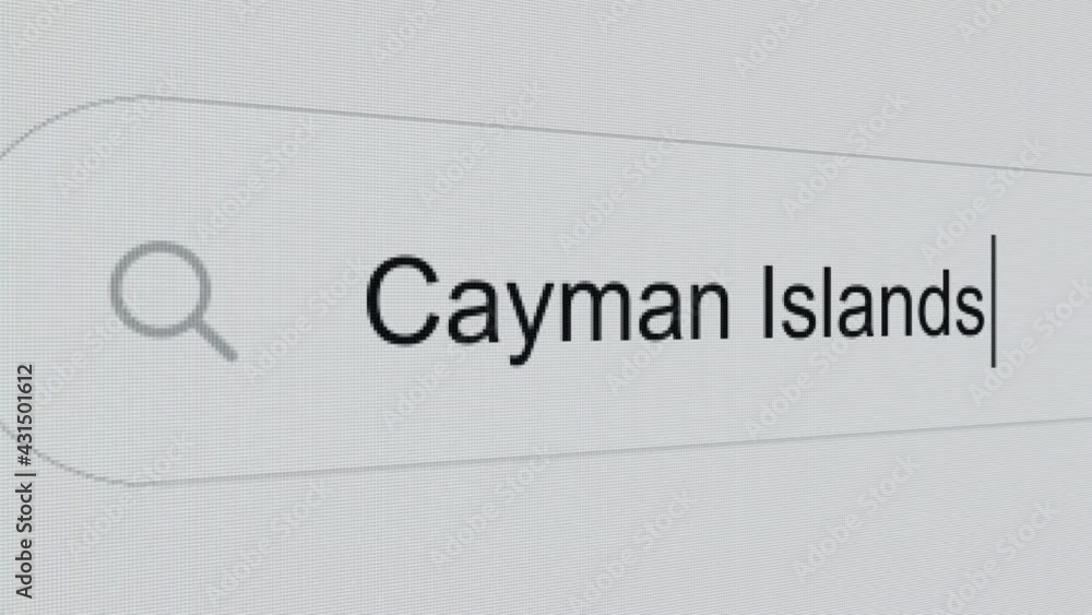 Cayman Islands - Pc screen internet browser search engine bar typing tax haven self-governing territory name. Cayman Islands - Pc screen internet browser search engine bar typing tax haven self-governing territory name.