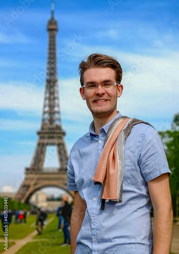 man in front of eiffel tower