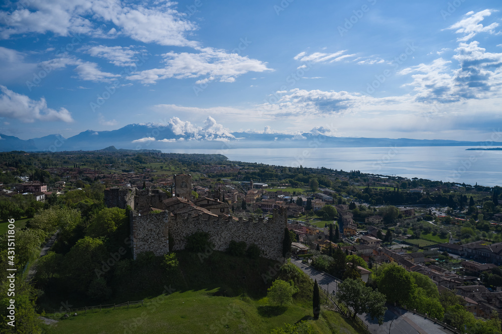 Aerial view of the historic part of Padenghe Castle on Lake Garda, Italy. Top view of the castle. Panorama of Lake Garda. Historic castles in Italy. Tourist places. Aerial view of the historic part of Padenghe Castle on Lake Garda, Italy. Top view of the castle. Panorama of Lake Garda. Historic castles in Italy. Tourist places.