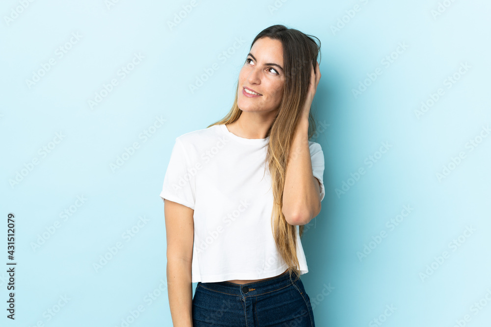 Young caucasian woman over isolated background thinking an idea Young caucasian woman over isolated background thinking an idea