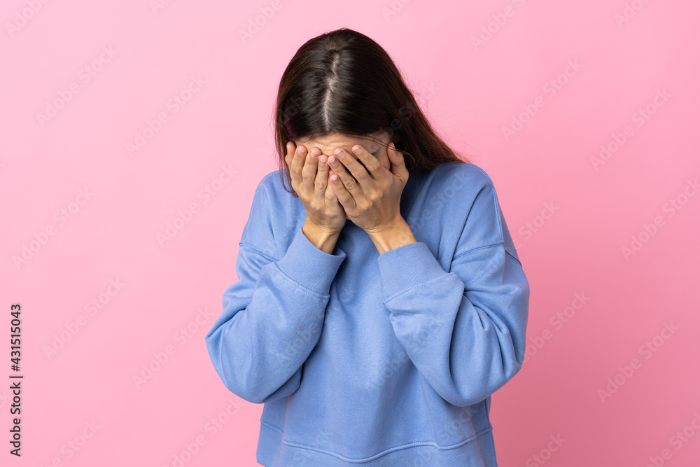 Young caucasian woman isolated on pink background with tired and sick expression Young caucasian woman isolated on pink background with tired and sick expression
