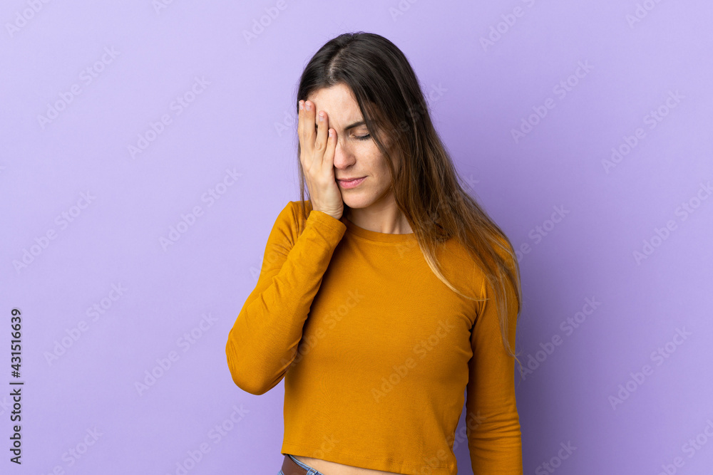 Young caucasian woman over isolated background with headache Young caucasian woman over isolated background with headache