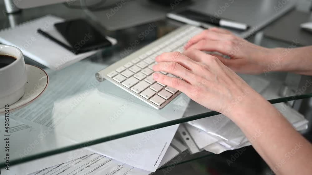 Technology concept - close up hands of unrecognizable woman sitting in front of computer with coffee and smartphone using keyboard typing working at home office. Remote distance work education Technology concept - close up hands of unrecognizable woman sitting in front of computer with coffee and smartphone using keyboard typing working at home office. Remote distance work education