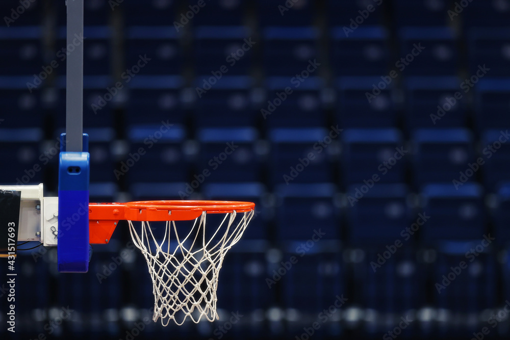 Basketball hoop on the background of the empty seats of the sports arena