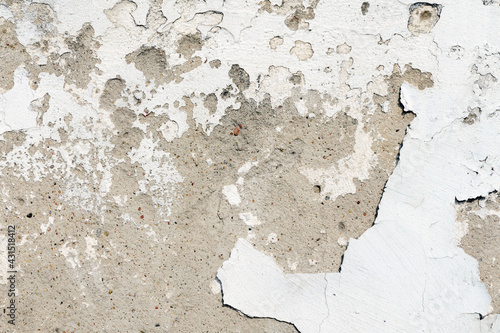stone wall with broken plaster. background. texture