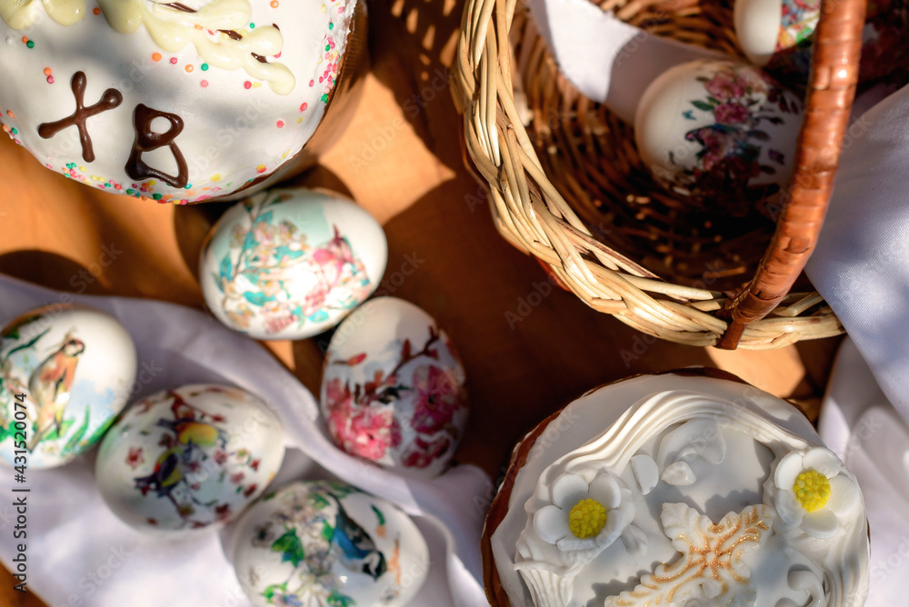 Easter blur background. Eggs in a basket, easter cakes. Easter flat lay.