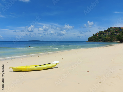 Yellow kayak on a tropical beach