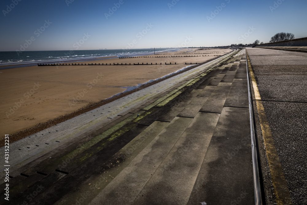 Steps to a deserted beach at Dymchurch, Kent, England