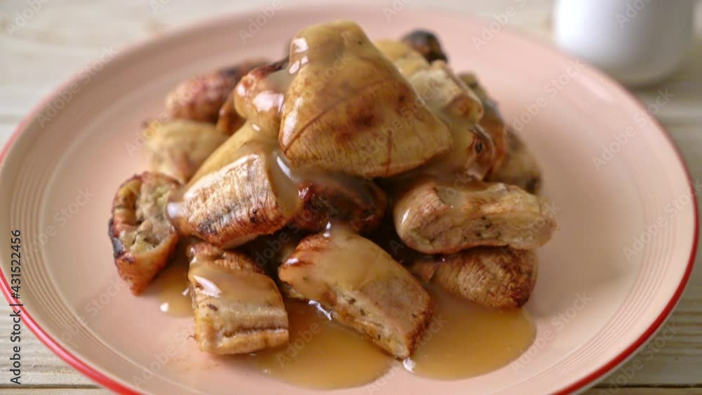 grilled bananas with coconut caramel sauce on plate grilled bananas with coconut caramel sauce on plate