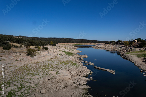 Adaja river's flow on a spring day photo