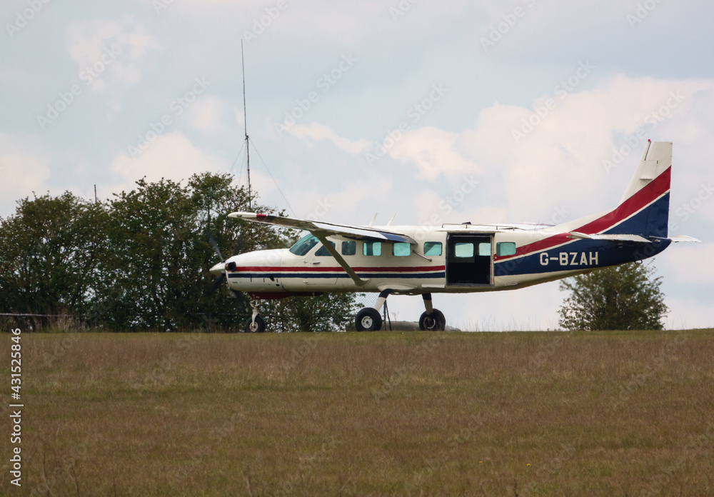 Cessna 208B Grand Caravan light aircraft returns after dropping Red Devils parachute display team Cessna 208B Grand Caravan light aircraft returns after dropping Red Devils parachute display team