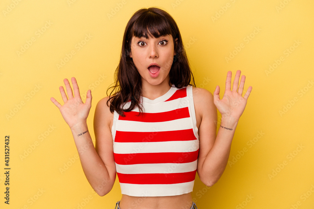 Young caucasian woman isolated on yellow background screaming to the sky, looking up, frustrated. Young caucasian woman isolated on yellow background screaming to the sky, looking up, frustrated.