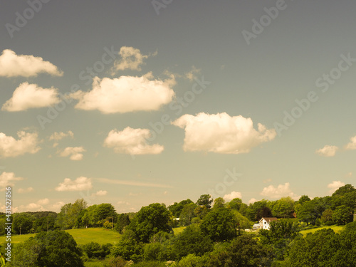 false colour vintage look of lovely summer countryside and blue sky