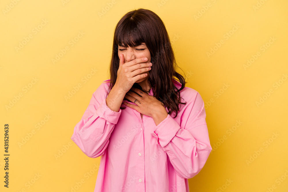 Young caucasian woman isolated on yellow background suffers pain in throat due a virus or infection. Young caucasian woman isolated on yellow background suffers pain in throat due a virus or infection.