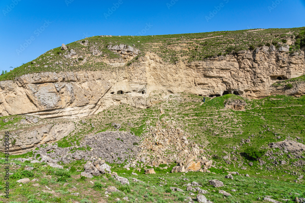 Ancient caves in a sheer cliff