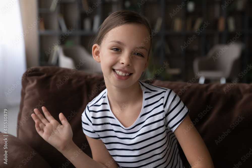 Profile picture of smiling little teen girl child wave greet at camera have  digital webcam virtual