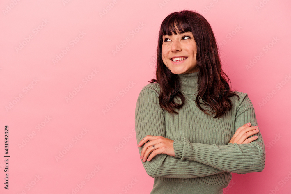 Young caucasian woman isolated on pink background smiling confident with crossed arms. Young caucasian woman isolated on pink background smiling confident with crossed arms.