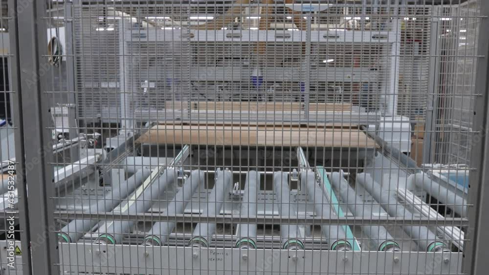 Carpentry factory. Production line of parquet board. Modern industrial factory for laminated flooring. Carpentry factory. Production line of parquet board. Modern industrial factory for laminated flooring.
