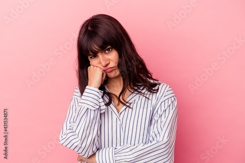 Young caucasian woman isolated on pink background tired of a repetitive task.