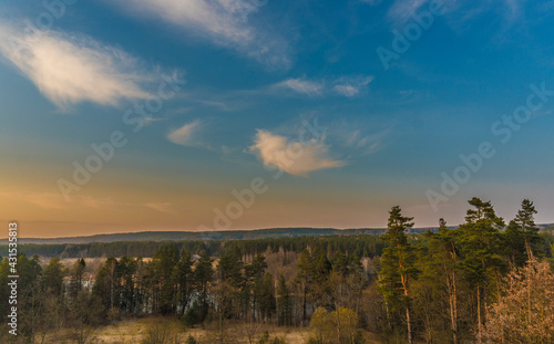 colorful sunset over the forest view from the hill © etraveler