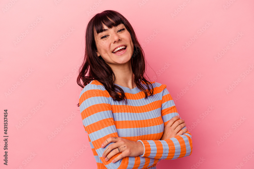 Young caucasian woman isolated on pink background laughing and having fun. Young caucasian woman isolated on pink background laughing and having fun.