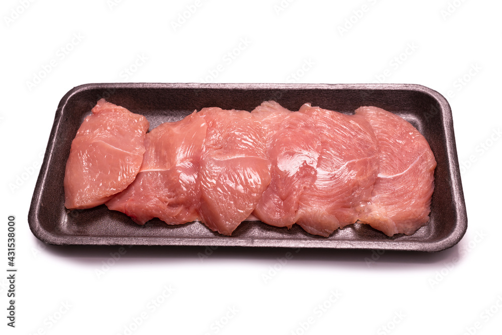 Turkey fillet in a black plastic container isolated. Turkey fillet in a black plastic container isolated.