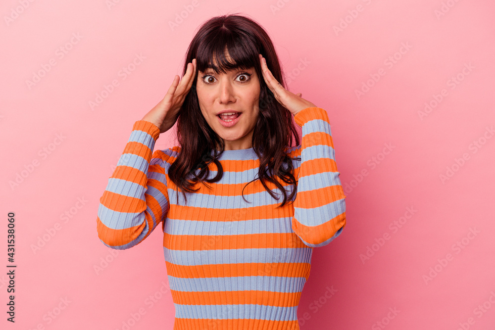 Young caucasian woman isolated on pink background receiving a pleasant surprise, excited and raising hands. Young caucasian woman isolated on pink background receiving a pleasant surprise, excited and raising hands.