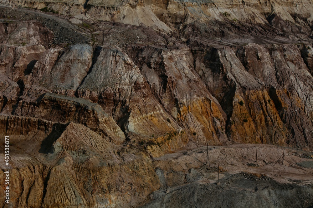 view of the reddish brown quarry wall