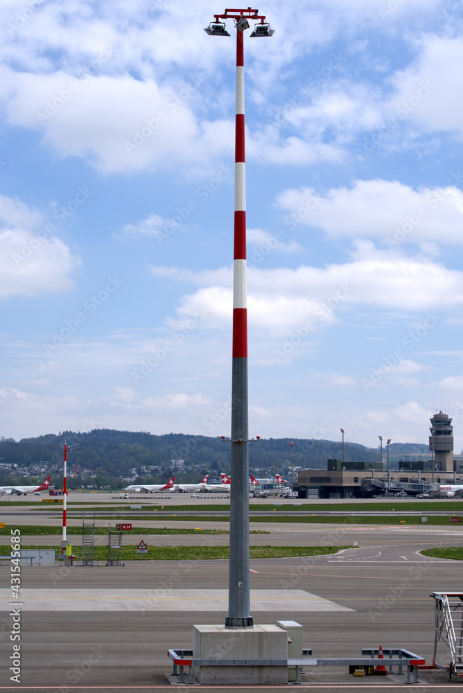 Spotlights on high pole at Zurich airport. Photo taken April 30th, 2021, Zurich, Switzerland.