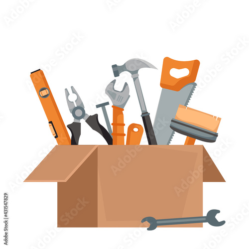 An open cardboard box in a package with a set of tools of a builder and a house painter inside. Vector illustration in cartoon flat style