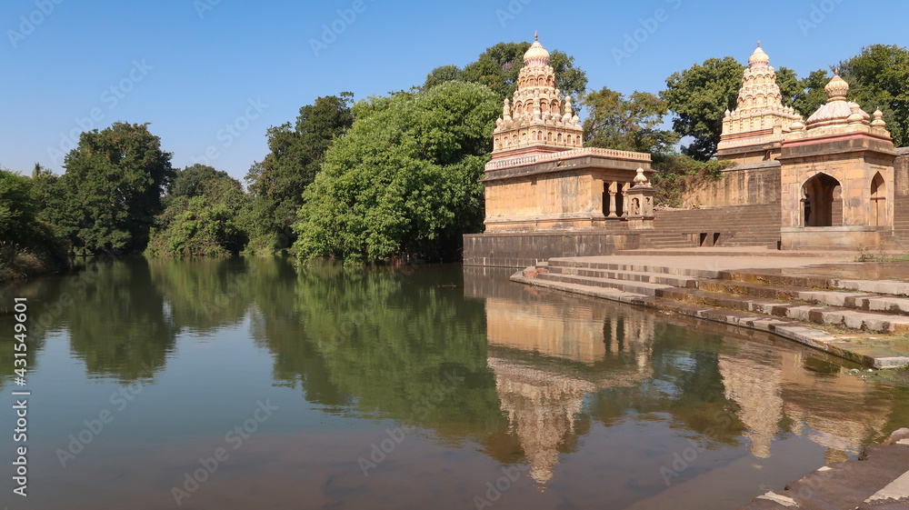 Wai , Maharashtra India- February 20 2021: Menawali ghat and temple with beautiful view of lake and greenery Wai , Maharashtra India- February 20 2021: Menawali ghat and temple with beautiful view of lake and greenery