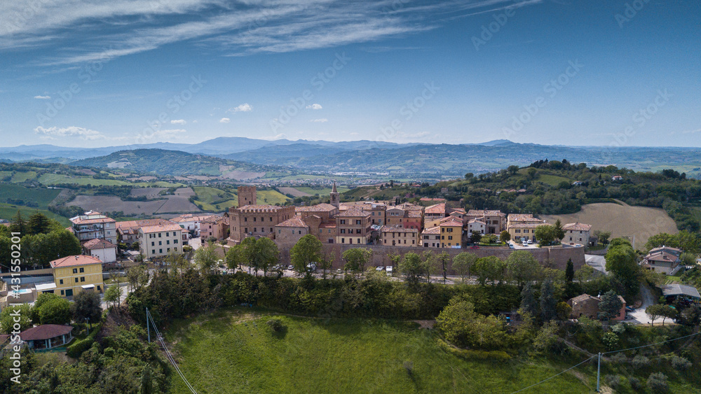 Italy, May 2021: aerial view of the medieval village of Sant'angelo in Lizzola in the province of Pesaro and Urbino in the Marche region. Around the hills of the Marche