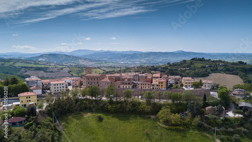 Italy, May 2021: aerial view of the medieval village of Sant'angelo in Lizzola in the province of Pesaro and Urbino in the Marche region. Around the hills of the Marche