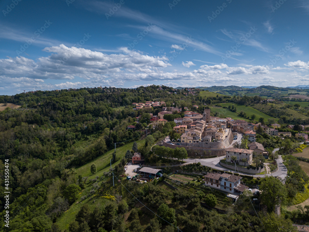 Italy, May 2021: aerial view of the medieval village of Sant'angelo in Lizzola in the province of Pesaro and Urbino in the Marche region. Around the hills of the Marche