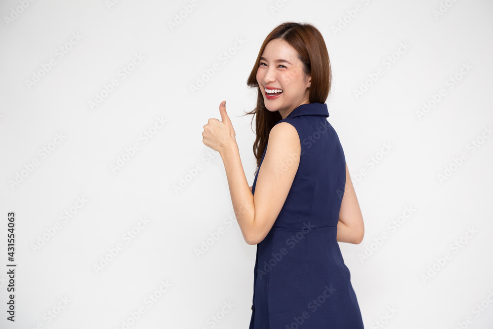 Smiling young Asian woman showing thumbs up isolated on white background Smiling young Asian woman showing thumbs up isolated on white background