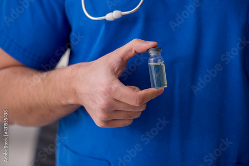 Young male doctor in vaccination concept during pandemic