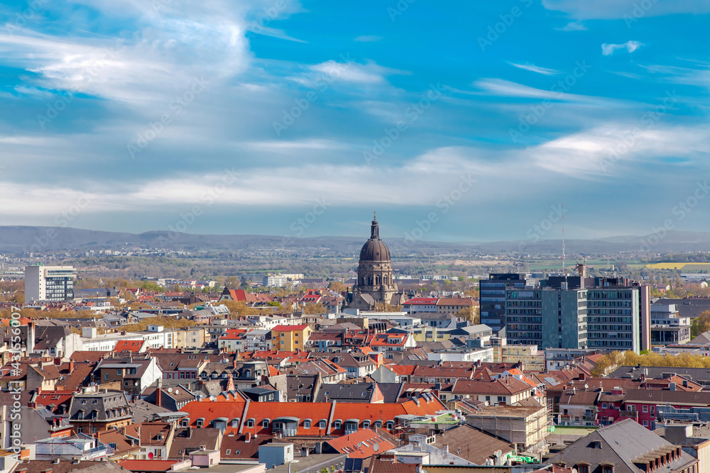 Aerial view of the City of Mainz, Germany on blue clouds sky. Christuskirche - Cathedral. Feldberg mountain in background