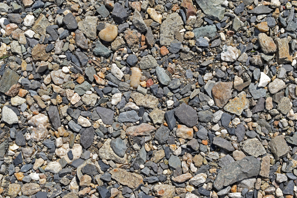 Large colorful pebbles and stones on the river bank