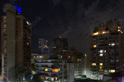 Tall apartment buildings at night. Residential neighborhood in Santiago, Chile. Mixed architecture construction concept