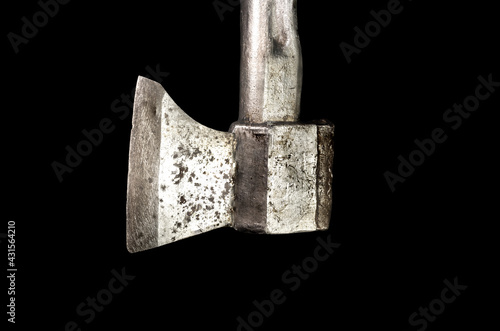 Old silver ax with a metal handle. Isolated on black background